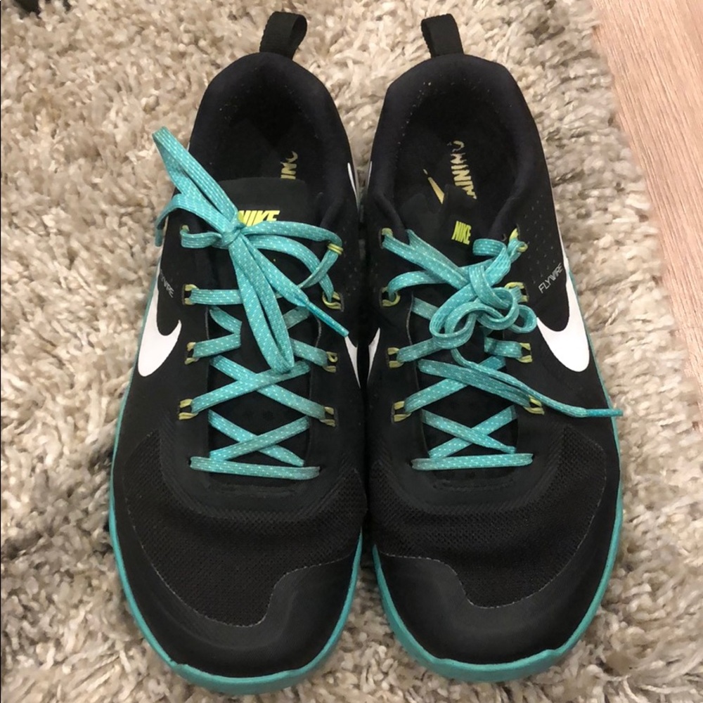 Original women’s Nike metcons in teal and black